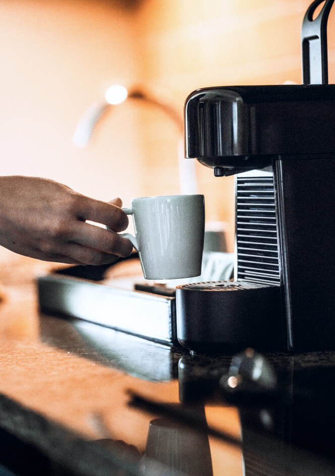 kitchenette with sink and nespresso machine coffee tea