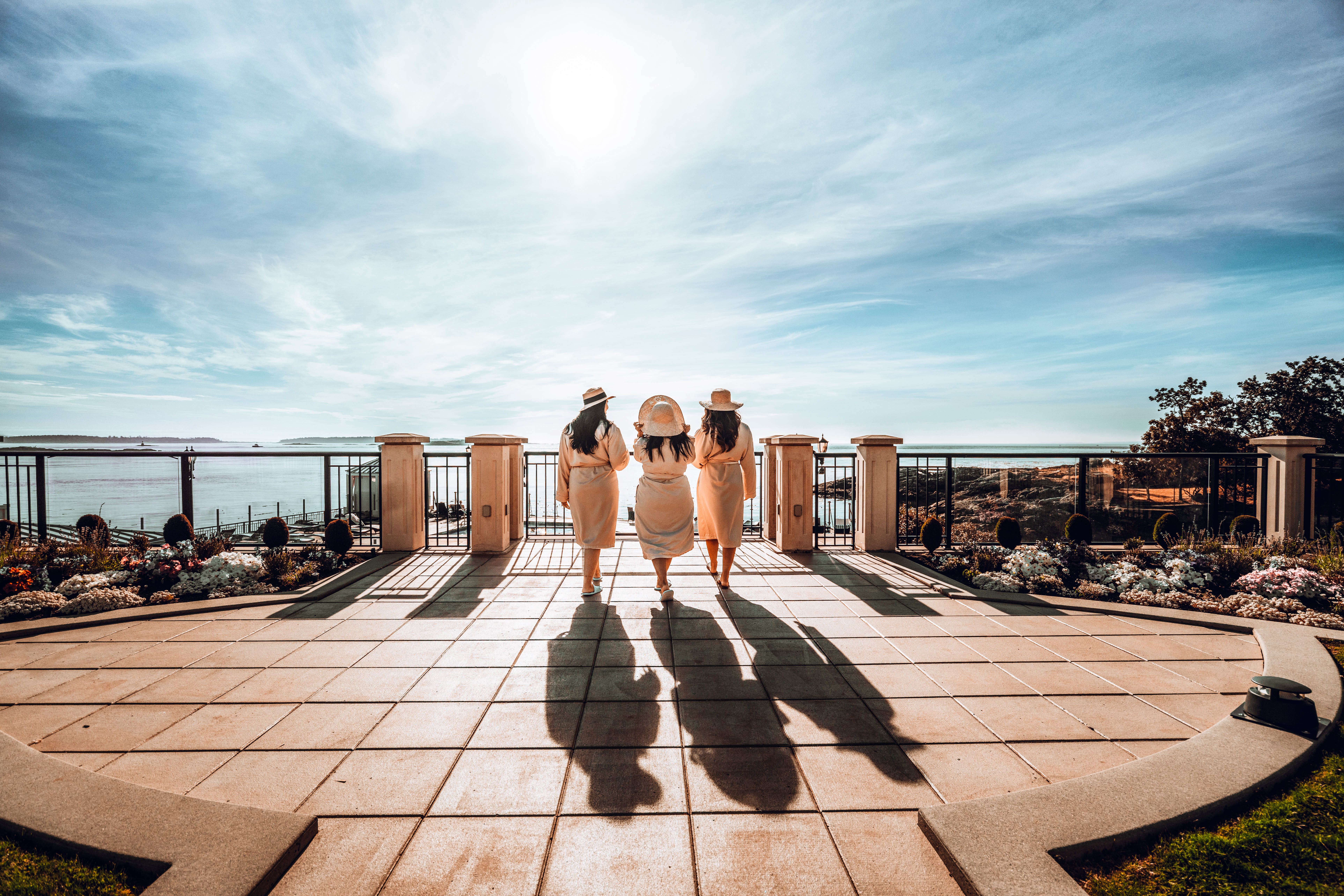 girls on seaside terrace in bath robes