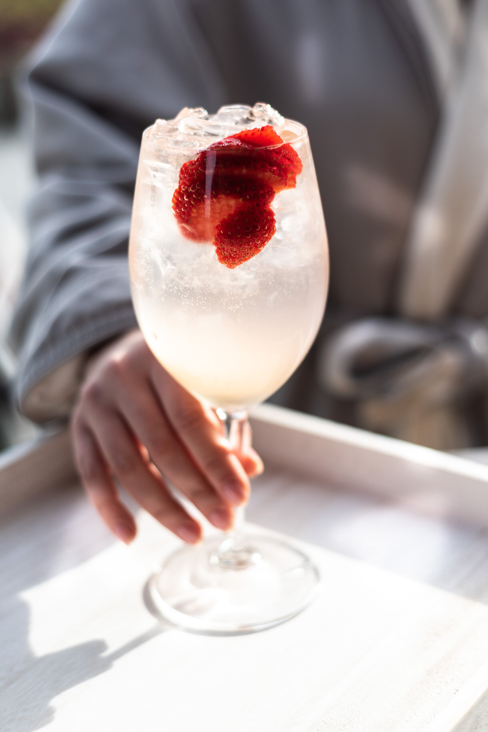 woman enjoying a refreshing cocktail after spa services