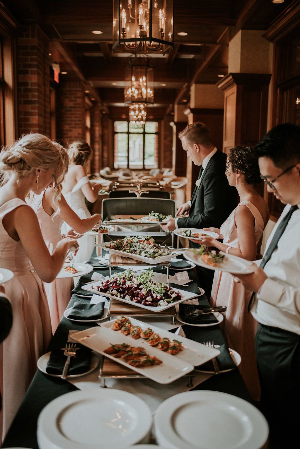 wedding guests lining up at buffet wedding dress