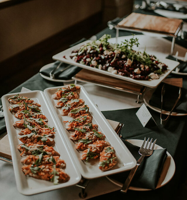 catered wedding event delicious plates of appetizers and salads