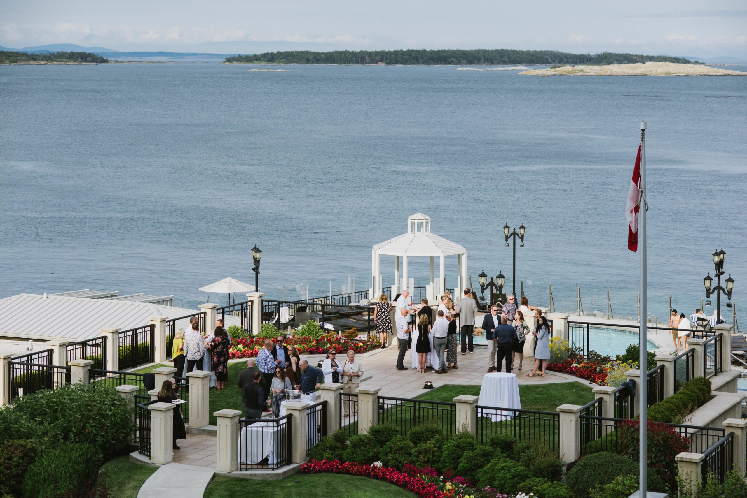 oak bay beach hotel seaside garden outdoor terrace cocktail table reception summer time luxury