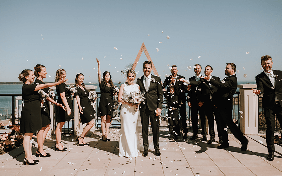 oak bay beach hotel wedding party celebrating bride and groom