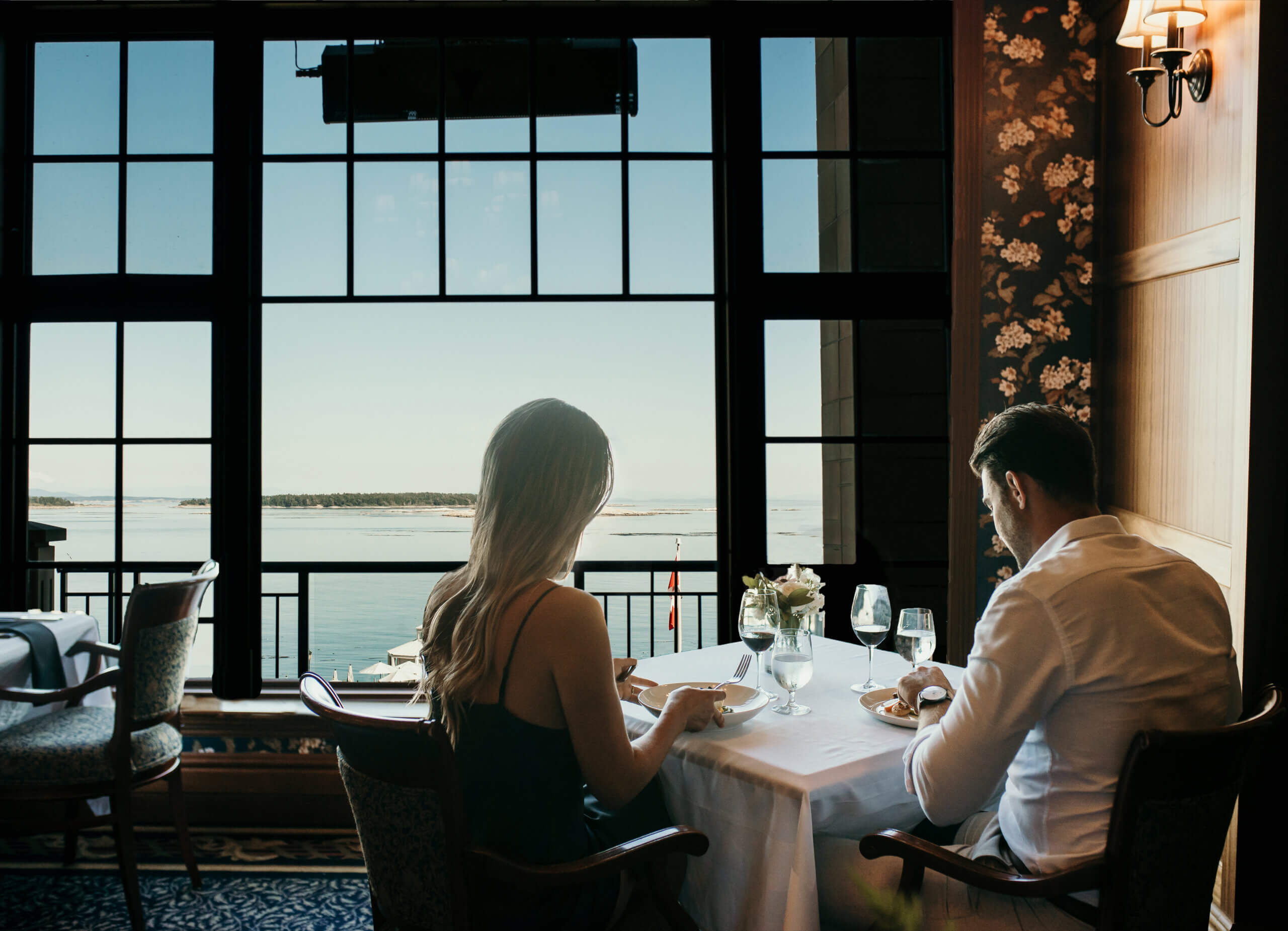 Couple Dining oak bay beach hotel fine dining ocean view wine