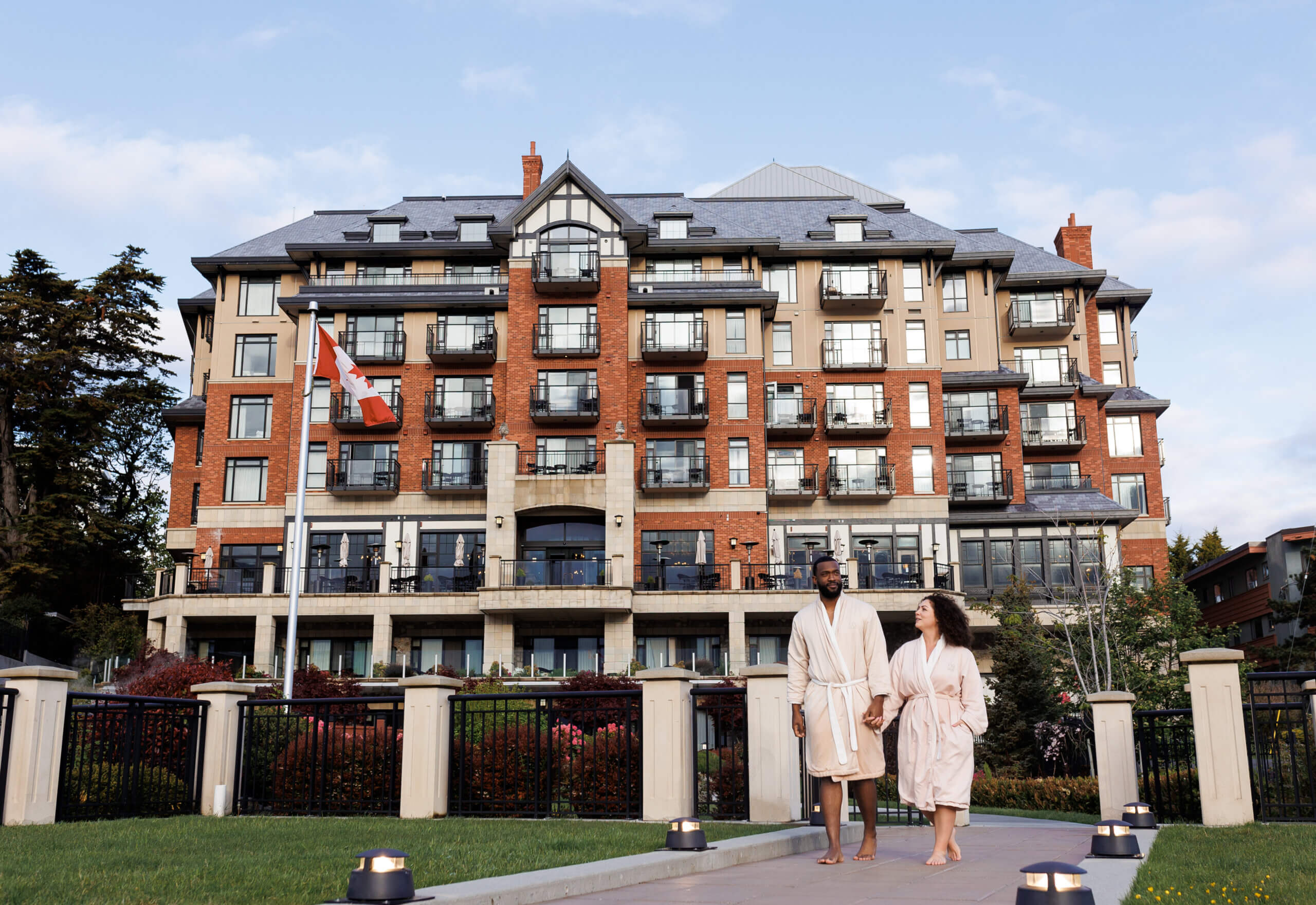 couple walking towards seaside garden terrace