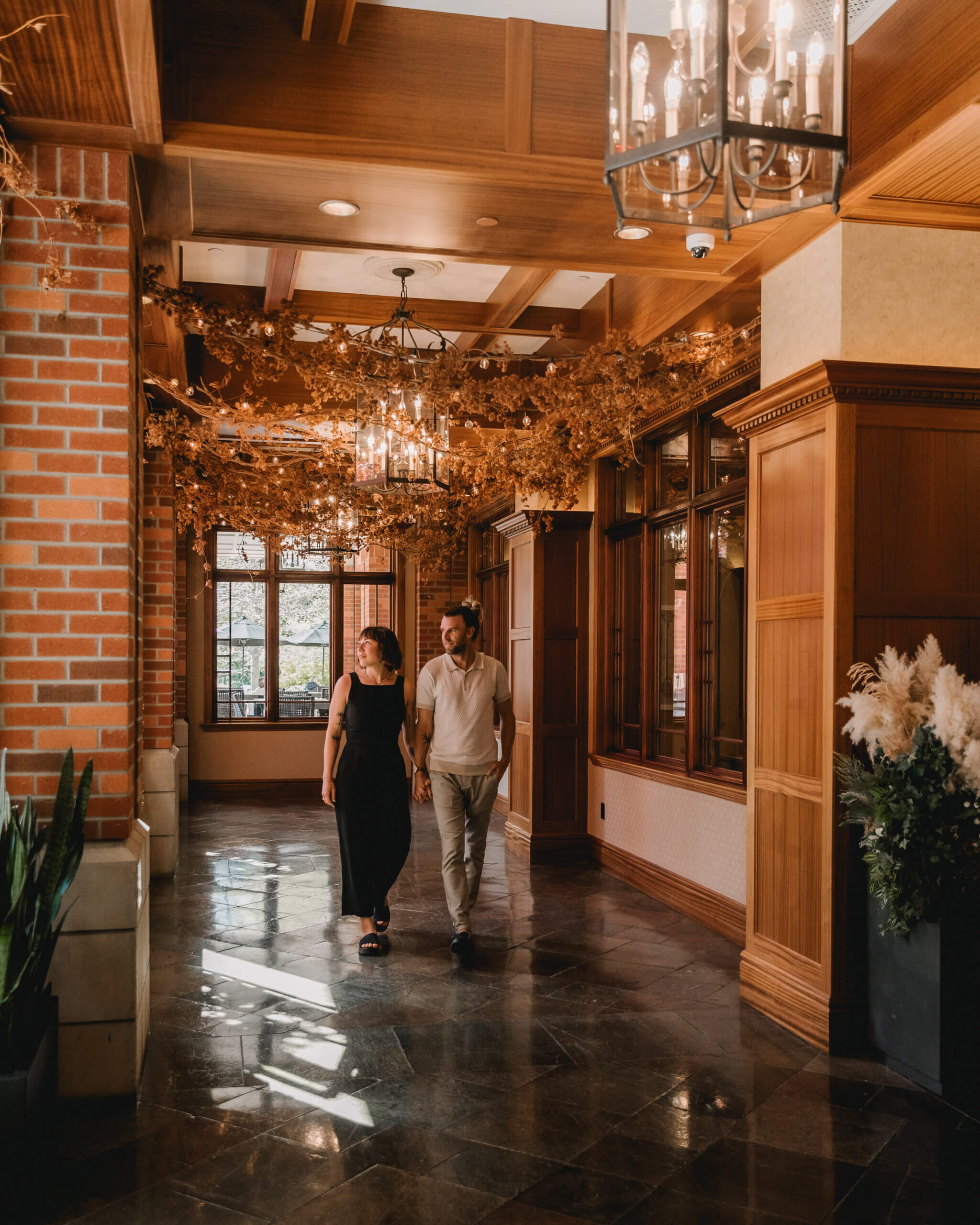 elegant luxury couple walking down hallway